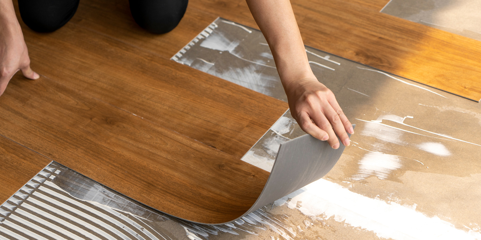 Vinyl flooring formats and adhesive application